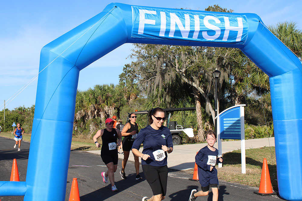 Photo of runners cross the finish line.